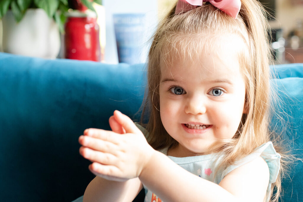 a girl clapping during a family photoshoot in Chicago